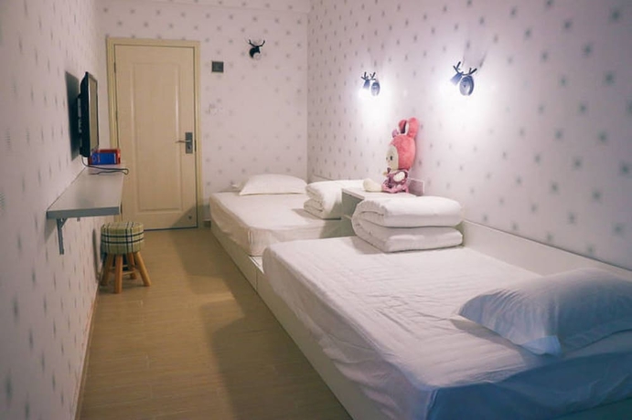 Imagen de la habitación del Hotel Jiulongwan Boutique Apartment. Foto 12