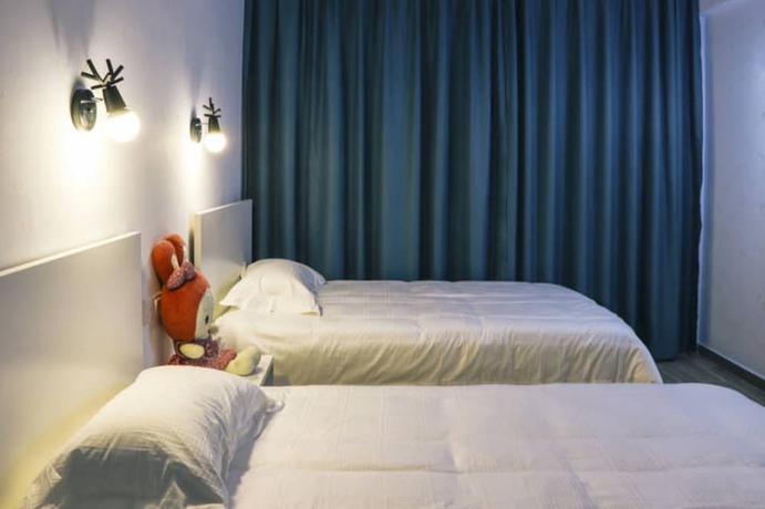 Imagen de la habitación del Hotel Jiulongwan Boutique Apartment. Foto 13