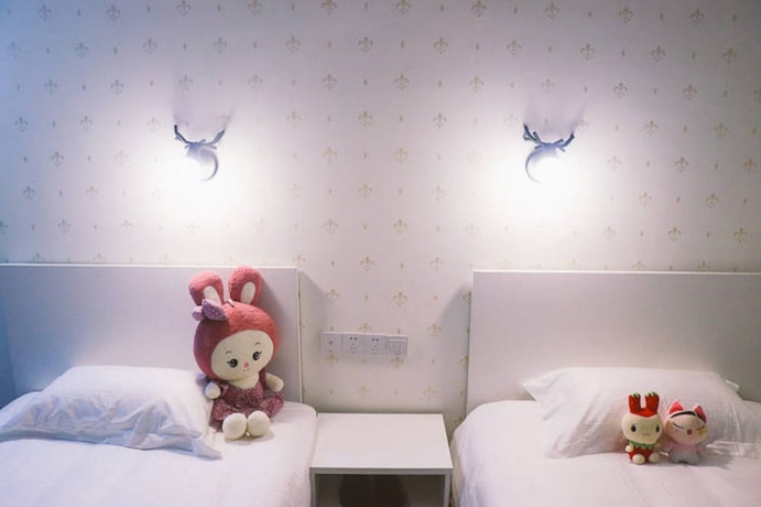 Imagen de la habitación del Hotel Jiulongwan Boutique Apartment. Foto 16