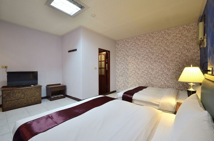 Imagen de la habitación del Hotel Jiuning Business. Foto 13
