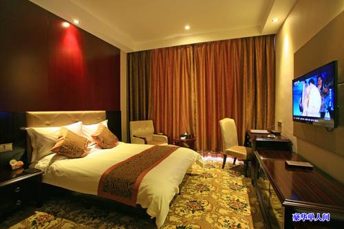 Imagen de la habitación del Hotel Jiuquan Longteng. Foto 1