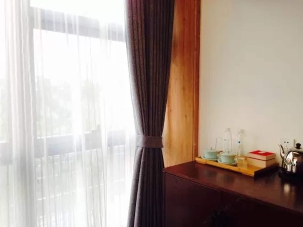 Imagen de la habitación del Hotel Jiushu Resorts Wuxi. Foto 15