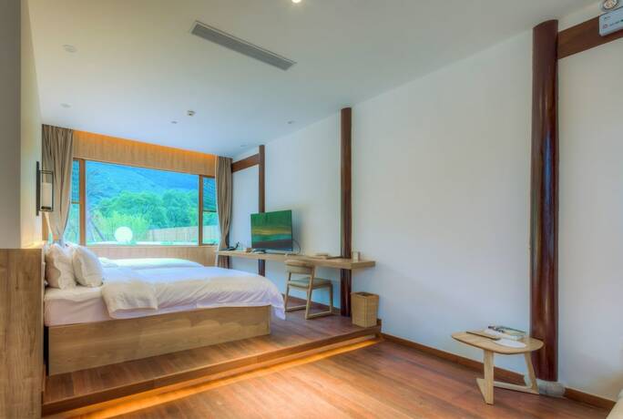 Imagen de la habitación del Hotel Jiushu Shuiyue Resorts. Foto 11