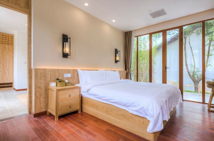 Imagen de la habitación del Hotel Jiushu Shuiyue Resorts. Foto 16