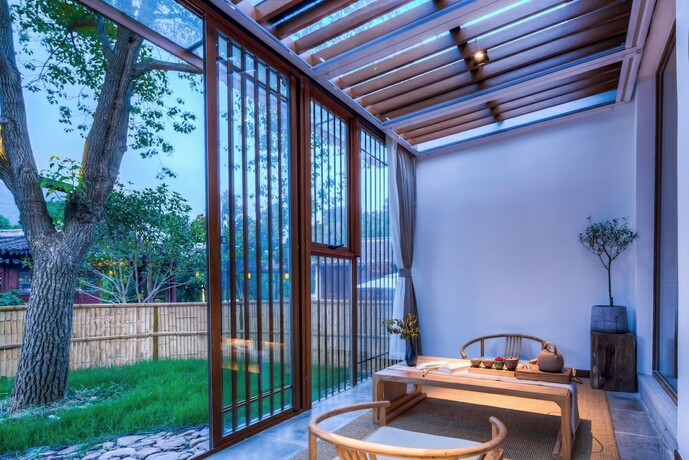 Imagen de la habitación del Hotel Jiushu Shuiyue Resorts. Foto 17