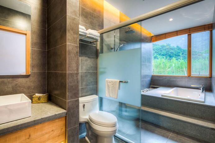 Imagen de la habitación del Hotel Jiushu Shuiyue Resorts. Foto 18