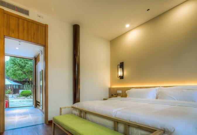 Imagen de la habitación del Hotel Jiushu Shuiyue Resorts. Foto 20