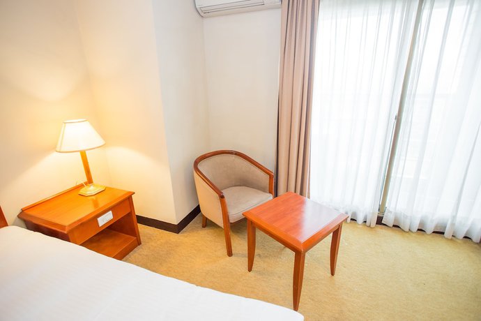 Imagen de la habitación del Hotel Jiuwu. Foto 12