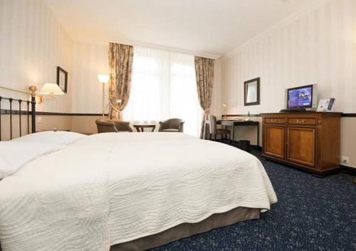 Imagen de la habitación del Hotel Jiuzhaigou Huangpu. Foto 12