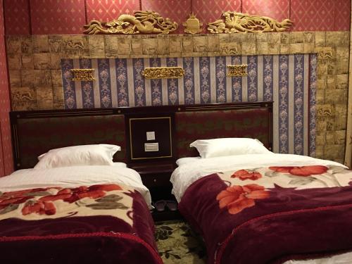 Imagen de la habitación del Hotel Jiuzhaigou Xin Tao Ge Tibetan Inn. Foto 9