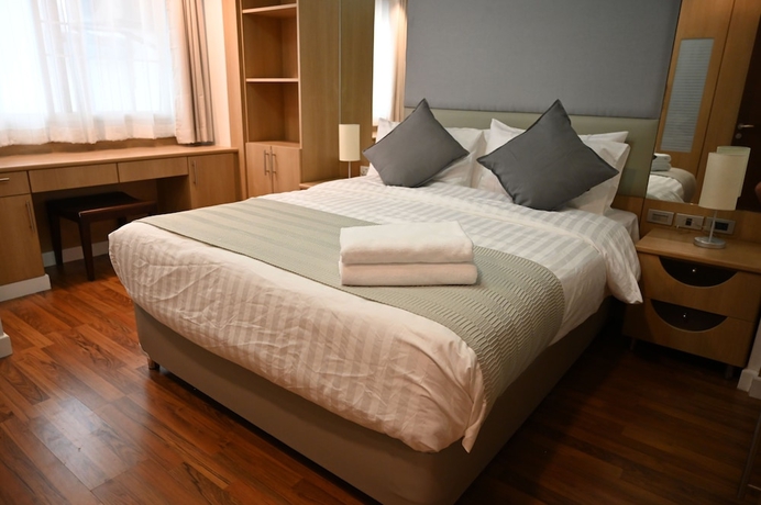 Imagen de la habitación del Hotel Jj Suites - Your Home On 11. Foto 7