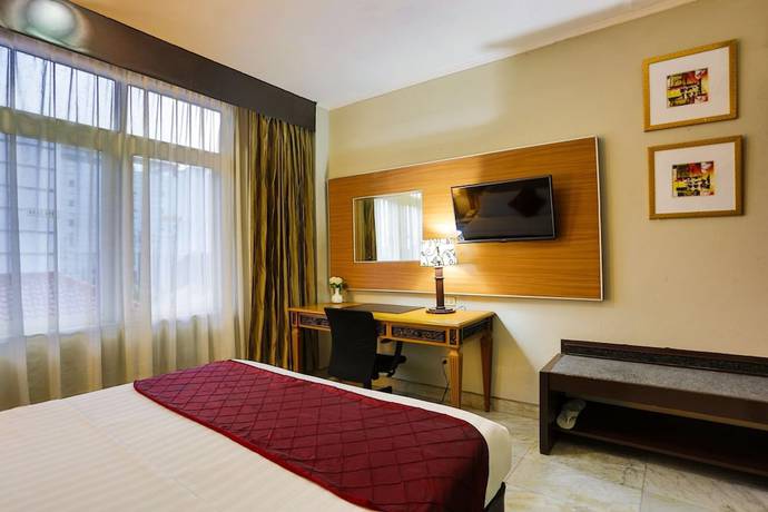 Imagen de la habitación del Hotel Johns Pardede International. Foto 7