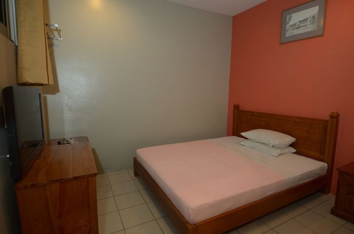 Imagen de la habitación del Hotel John's Place. Foto 13