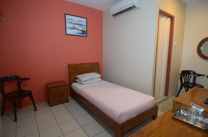Imagen de la habitación del Hotel John's Place. Foto 14