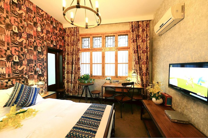 Imagen de la habitación del Hotel Jomo Fenghuang. Foto 8