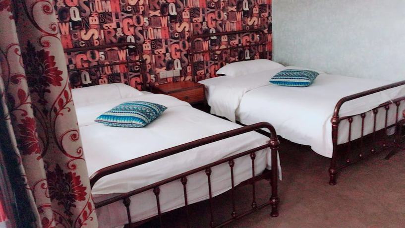 Imagen de la habitación del Hotel Jomo Fenghuang. Foto 9