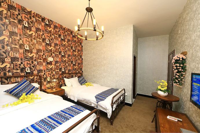 Imagen de la habitación del Hotel Jomo Fenghuang. Foto 11