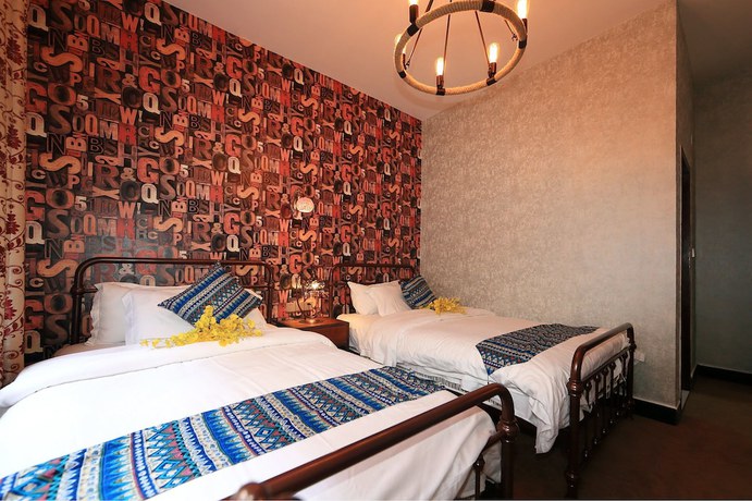 Imagen de la habitación del Hotel Jomo Fenghuang. Foto 13