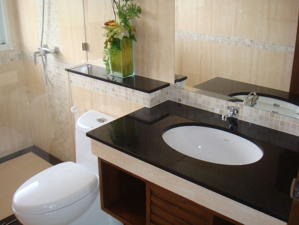 Imagen de la habitación del Hotel Jomtien Beach Penthouses. Foto 11