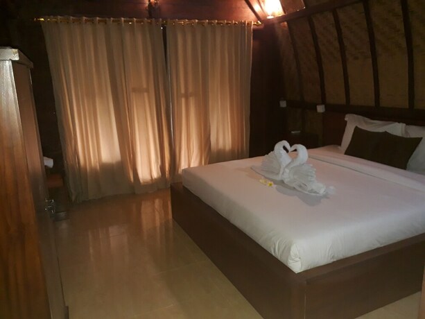 Imagen de la habitación del Hotel Jona Bungalow. Foto 28