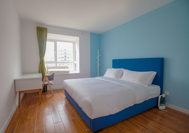 Imagen de la habitación del Hotel Joy Apartment Beijing. Foto 15
