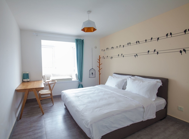 Imagen de la habitación del Hotel Joy Apartment Beijing. Foto 16