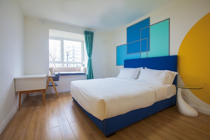 Imagen de la habitación del Hotel Joy Apartment Beijing. Foto 19