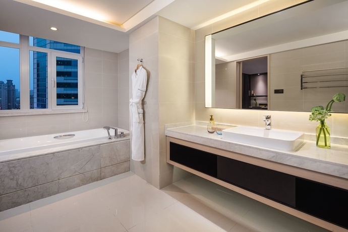 Imagen de la habitación del Hotel Joya Dalian. Foto 7