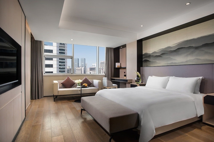Imagen de la habitación del Hotel Joya Dalian. Foto 8
