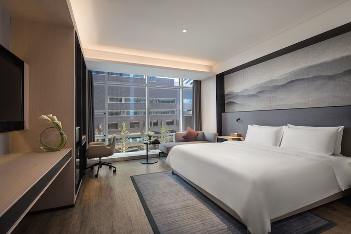 Imagen de la habitación del Hotel Joya Dalian. Foto 10