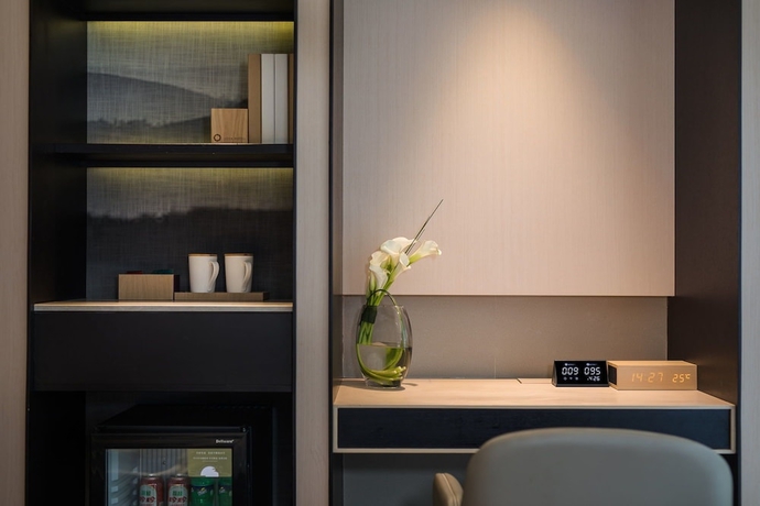 Imagen de la habitación del Hotel Joya Dalian. Foto 11