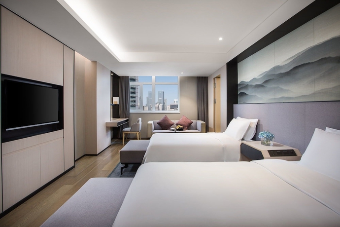Imagen de la habitación del Hotel Joya Dalian. Foto 12