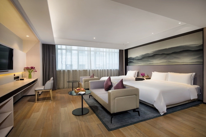 Imagen de la habitación del Hotel Joya Dalian. Foto 13