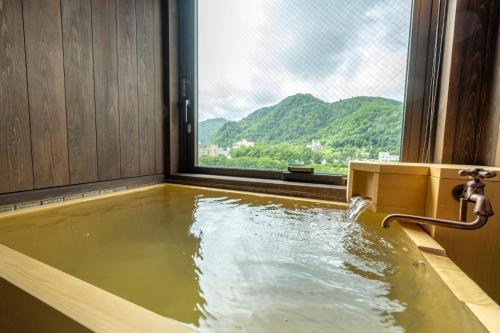 Imagen de la habitación del Hotel Jozankei Onsen Yurakusoan. Foto 16