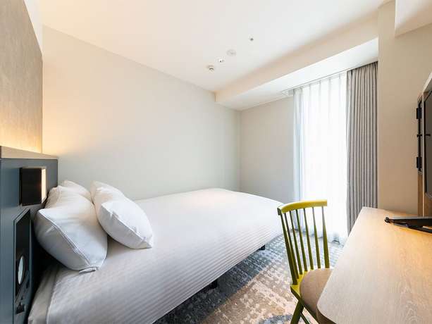 Imagen de la habitación del Hotel Jr-east Mets Yokohama. Foto 9