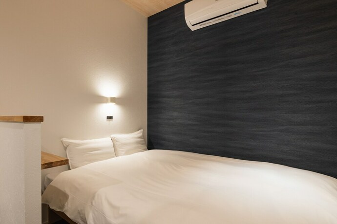 Imagen de la habitación del Hotel J-stay Beppu Indigo. Foto 22