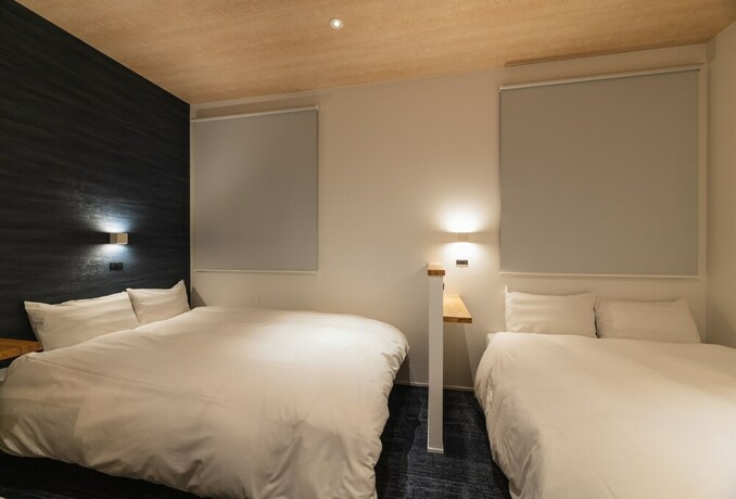 Imagen de la habitación del Hotel J-stay Beppu Indigo. Foto 29