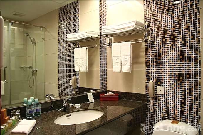 Imagen de la habitación del Hotel Judge Home Hotel - Beijing. Foto 11