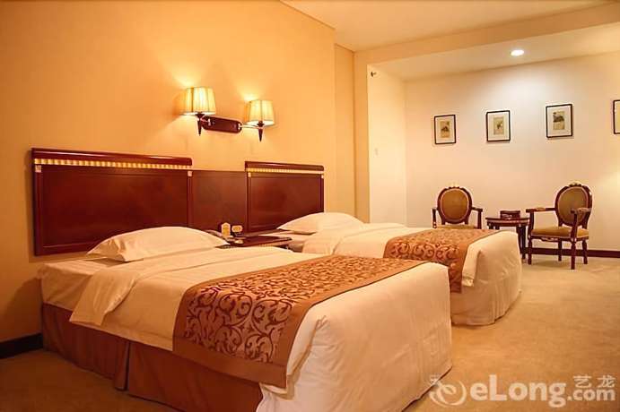 Imagen de la habitación del Hotel Judge Home Hotel - Beijing. Foto 14