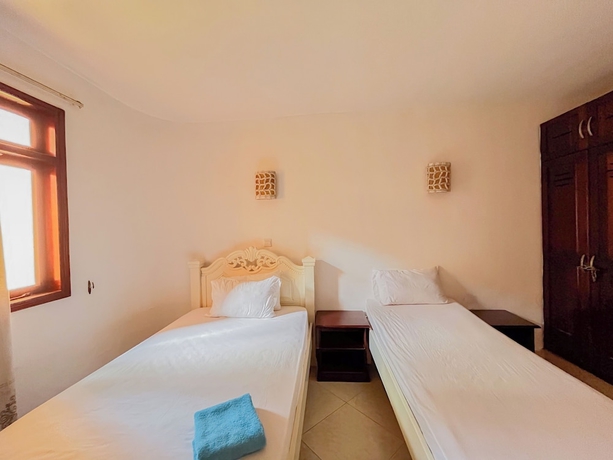 Imagen de la habitación del Hotel Jujo Beachfront Apartments. Foto 7