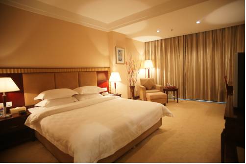Imagen de la habitación del Hotel Jun Hao. Foto 1