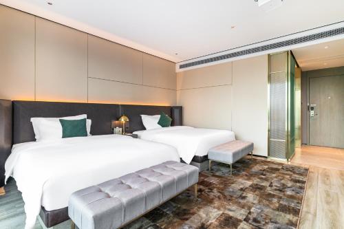 Imagen de la habitación del Hotel Jun Ming Happy World Yishang PLUS, Guangzhou. Foto 15