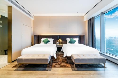 Imagen de la habitación del Hotel Jun Ming Happy World Yishang PLUS, Guangzhou. Foto 17