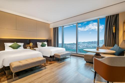 Imagen de la habitación del Hotel Jun Ming Happy World Yishang PLUS, Guangzhou. Foto 18