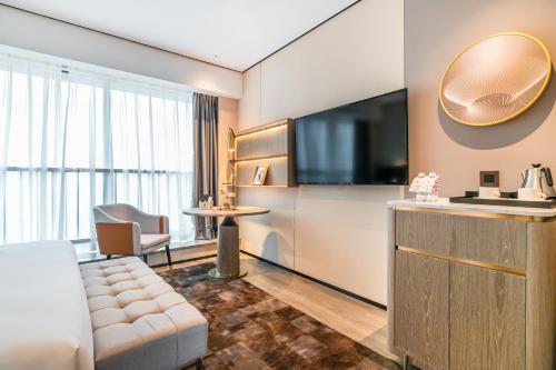 Imagen general del Hotel Jun Ming Happy World Yishang PLUS, Guangzhou. Foto 3