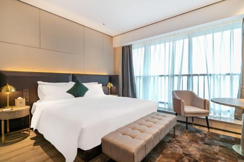 Imagen de la habitación del Hotel Jun Ming Happy World Yishang PLUS, Guangzhou. Foto 19
