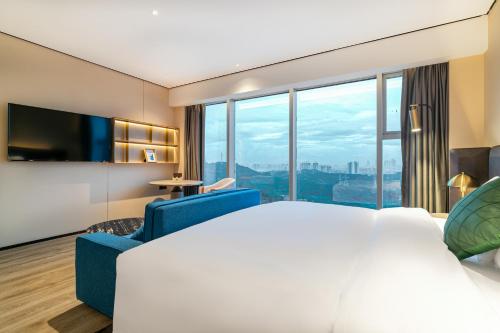 Imagen general del Hotel Jun Ming Happy World Yishang PLUS, Guangzhou. Foto 5