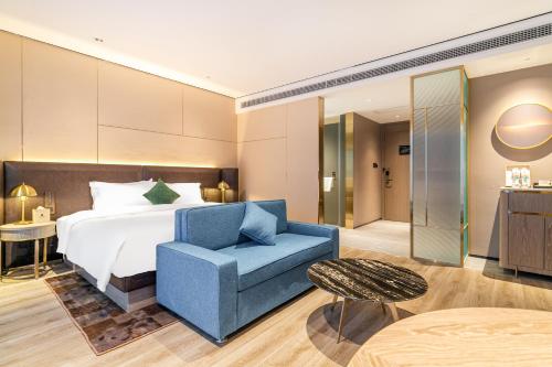 Imagen de la habitación del Hotel Jun Ming Happy World Yishang PLUS, Guangzhou. Foto 20