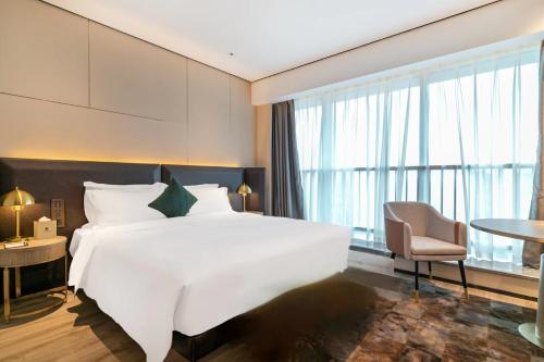 Imagen general del Hotel Jun Ming Happy World Yishang PLUS, Guangzhou. Foto 10