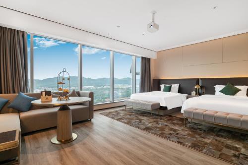 Imagen general del Hotel Jun Ming Happy World Yishang PLUS, Guangzhou. Foto 12
